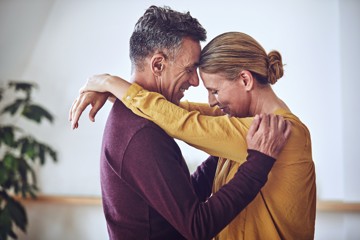 man woman hugging