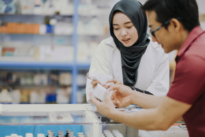 woman-and-man-holding-medicines