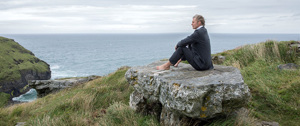 man-sitting-on-a-rock