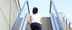 Woman running up escalator, symbolizing struggle communicating with HD