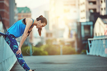 Woman with asthma trying to catch her breath and regulate her emotions while out for a run