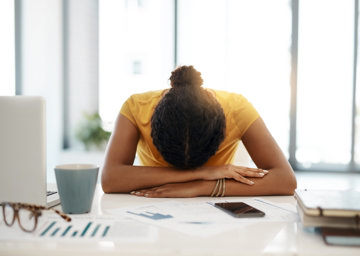 young woman laying on head upset