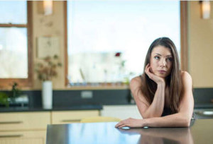 Girl-Thinking-In-The-Kitchen