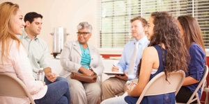 Support group sat in chairs talking about the stigma and patronizing language they face daily due to their disabilities