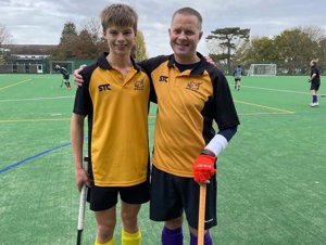  Tim Wotton and his son, Felix, playing hockey for their team in London, United Kingdom