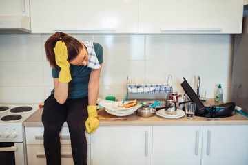 Woman struggling with depression and overload of household chores